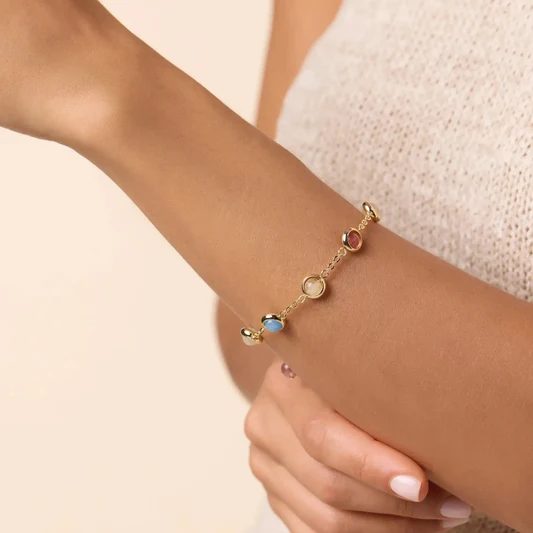 Pulsera de oro de mujer con piedras de color en cabujón